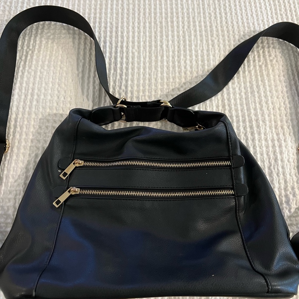 Sondra Roberts Black and Gold Backpack Sleek Design